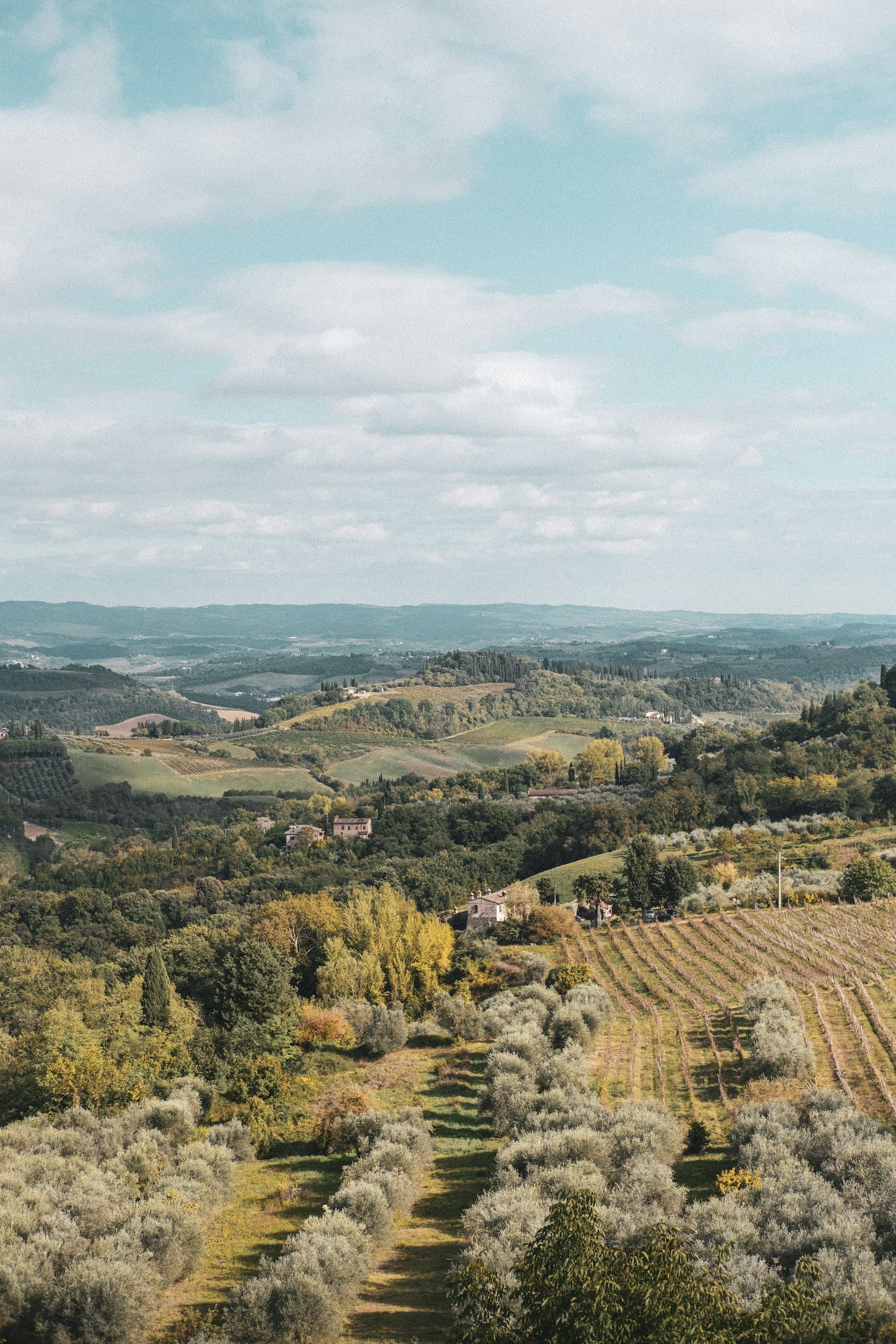 Valley panorama with green parcels and the sierra behind