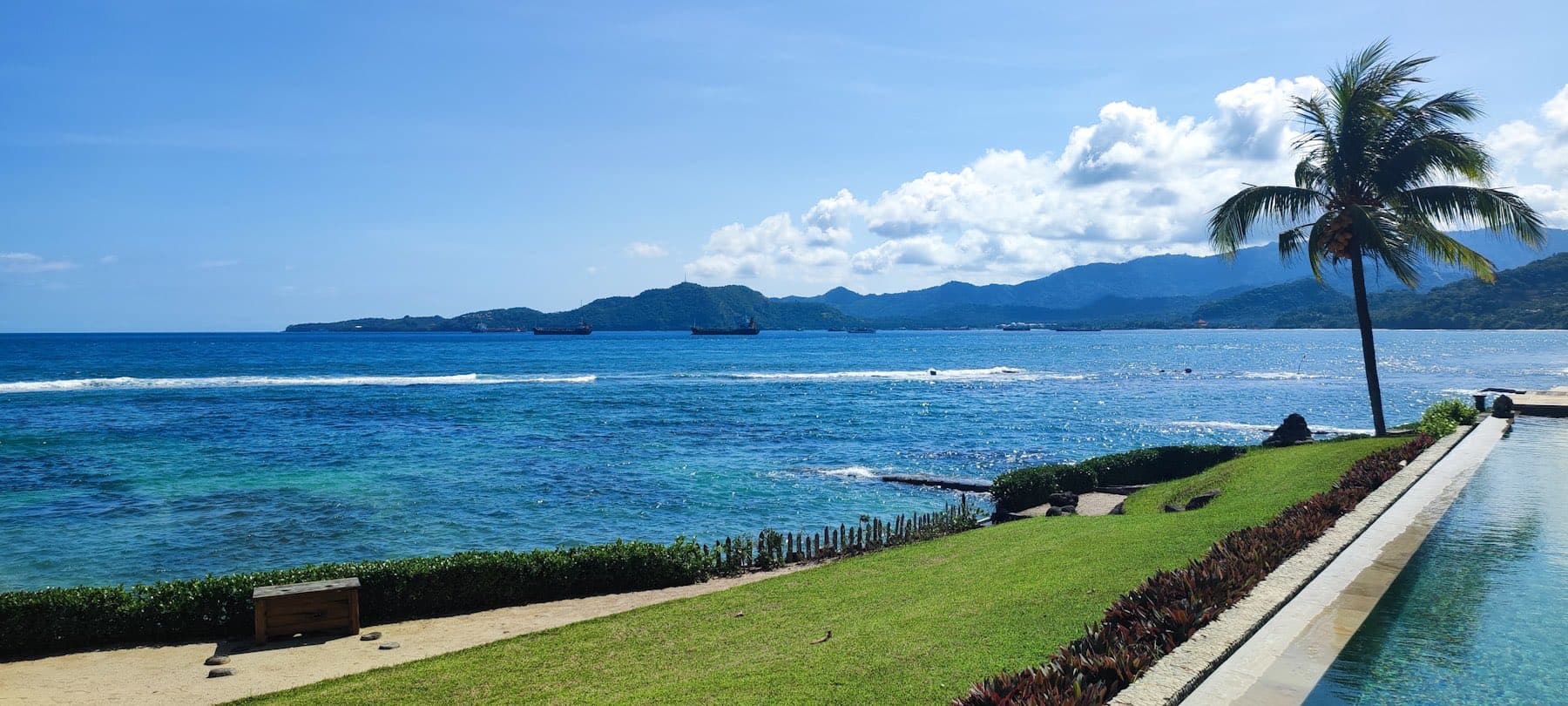 Cuastecomate bay with green hills falling to the water